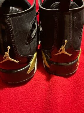 Jordan Kids Black and Gold High-Top Sneakers with Metallic Jumpman
